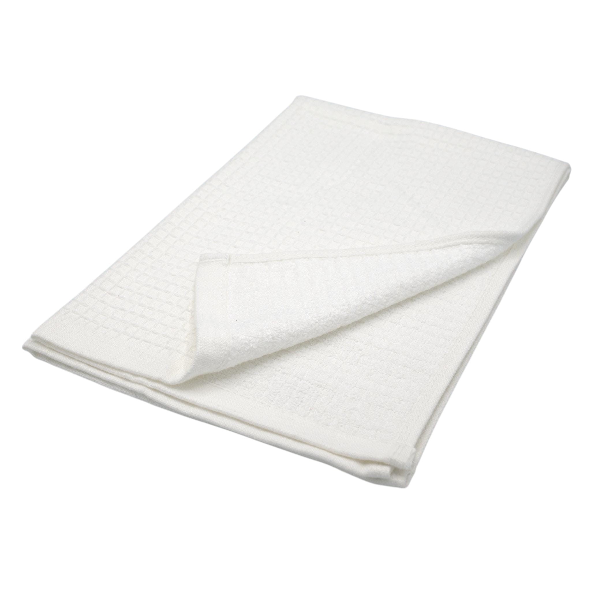 Hem And Tassel white reversible kitchen towel with a ribbed waffle texture on one side and soft terry on the other.