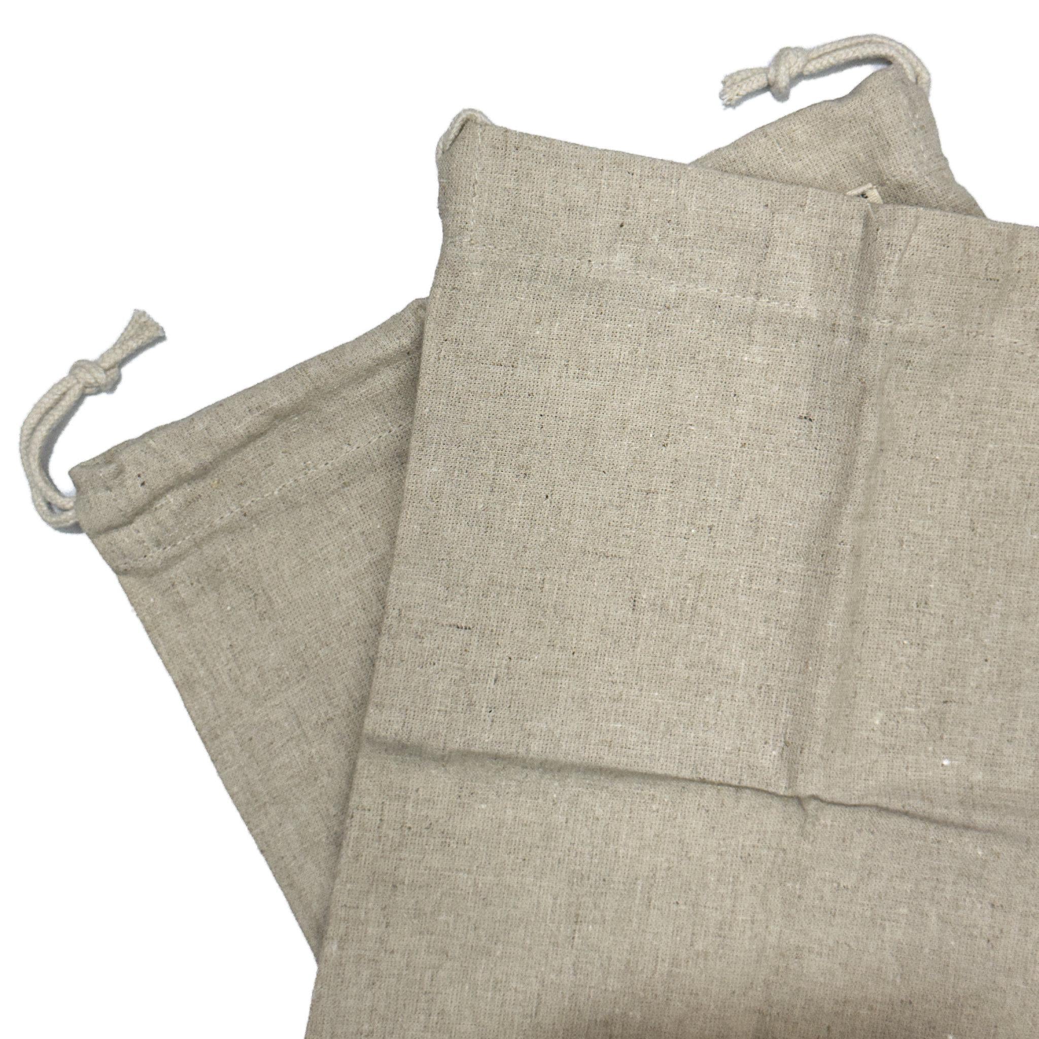 two fair trade hemp cotton produce bags with draw strings from Hem And Tassel  on a white background