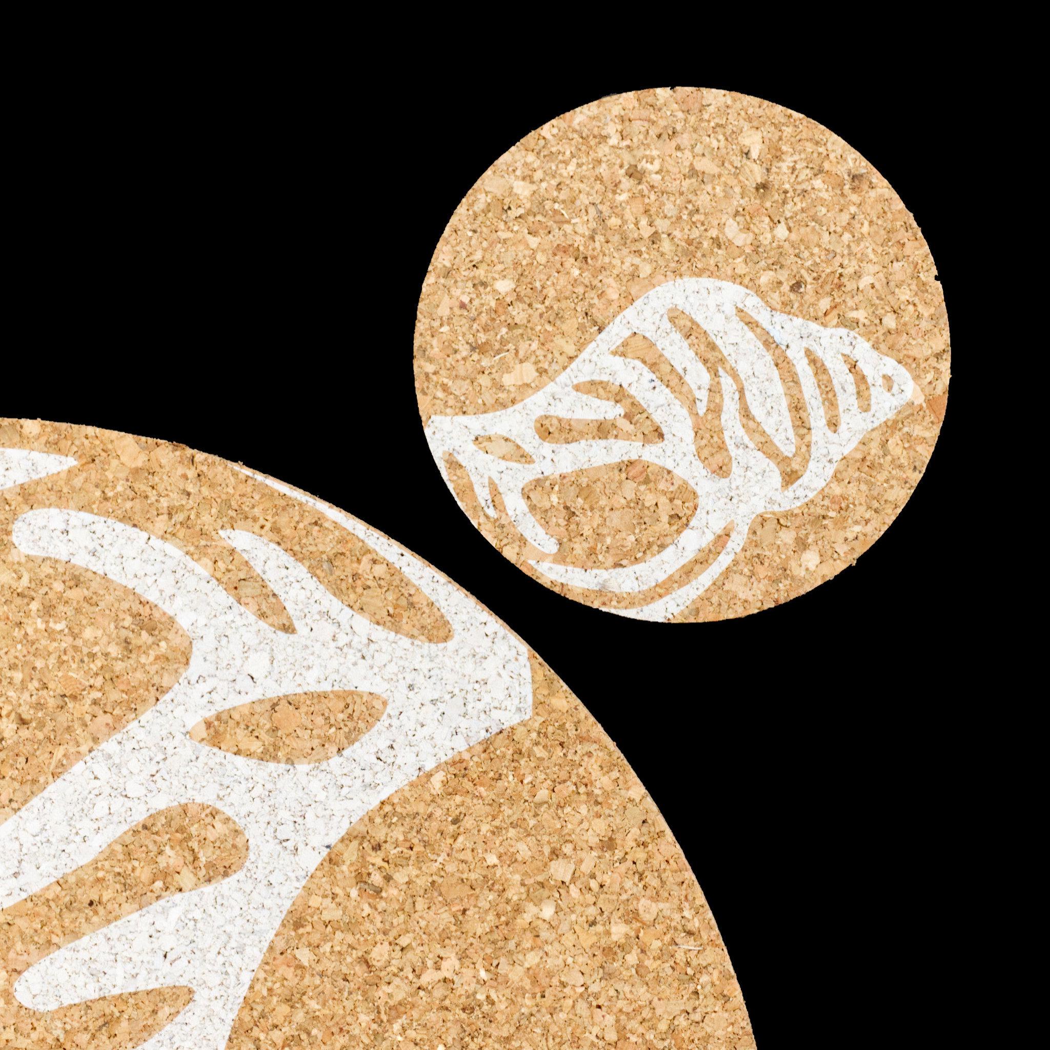 home by the sea cork coaster and matching placemat from Hem And Tassel on black background