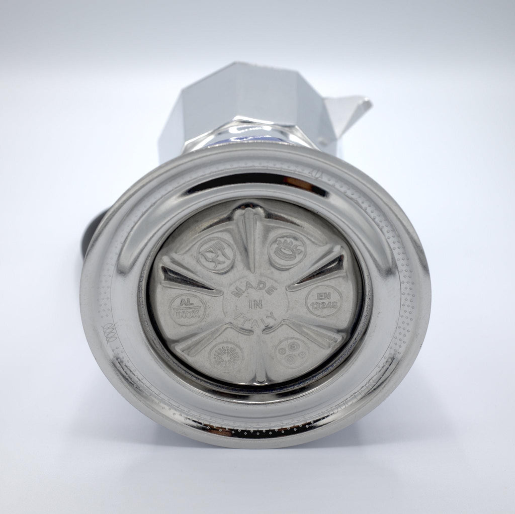 under side of induction moka pot  showing made int italy stamp and other logos, on a white background from Hem And Tassel 