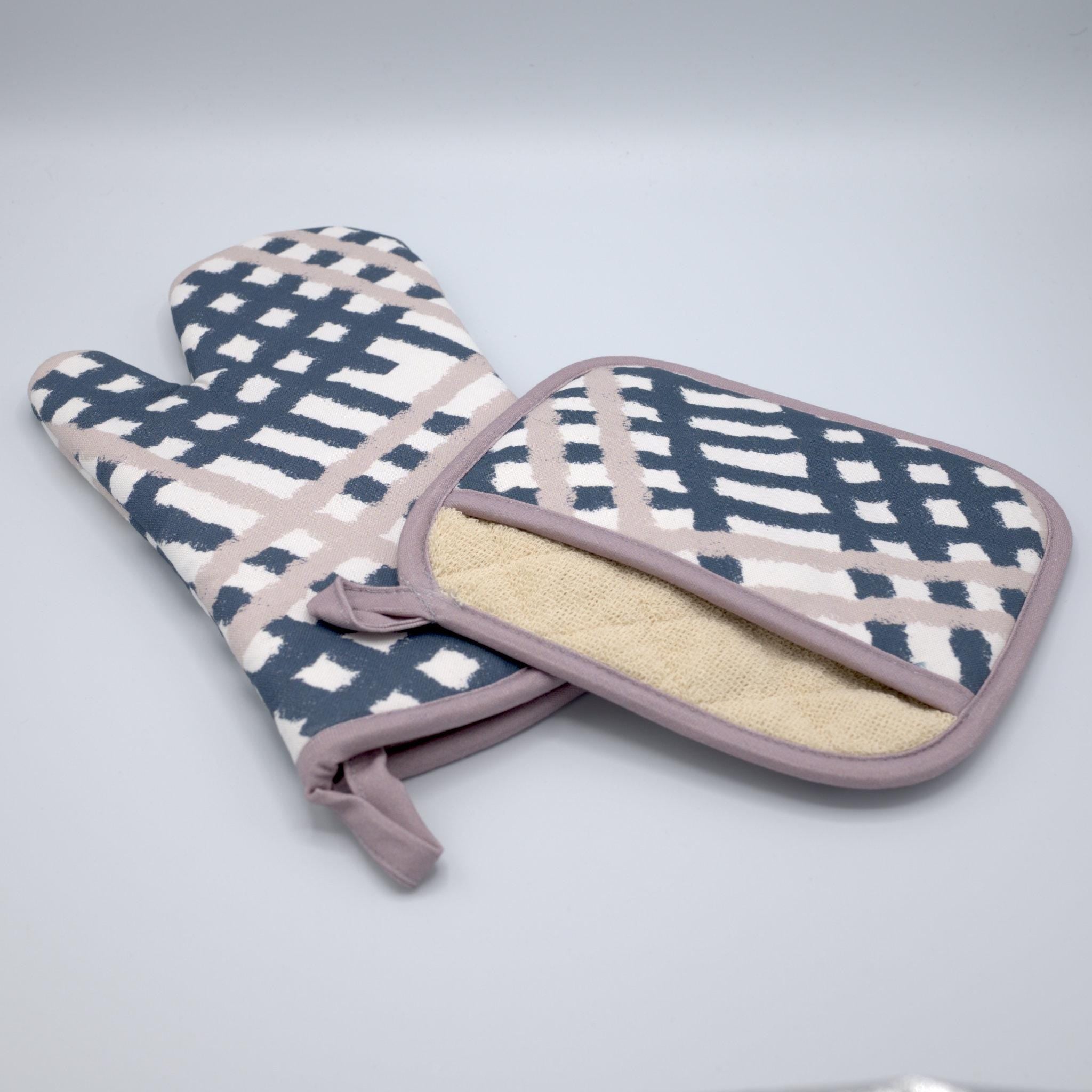 rich cotton oven mitt and pot holder of jute impossible design, in grey and oil colors against light grey backdrop - from Hem And Tassel
