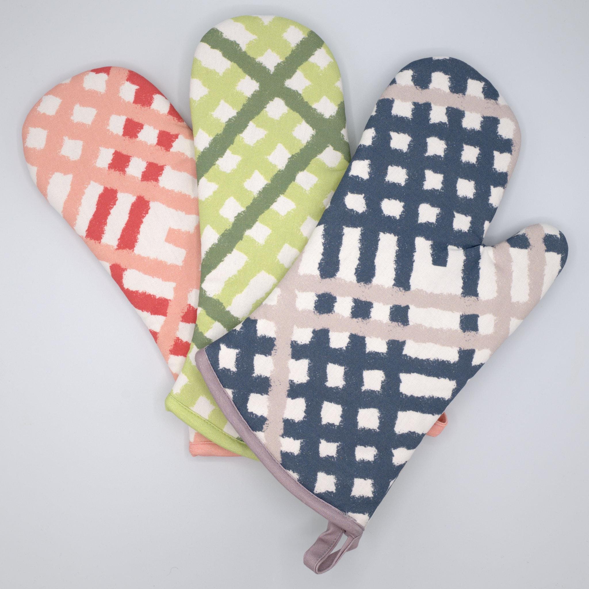 Set of three colors of jute impossible oven mitts on a light gray background from Hem And Tassel 