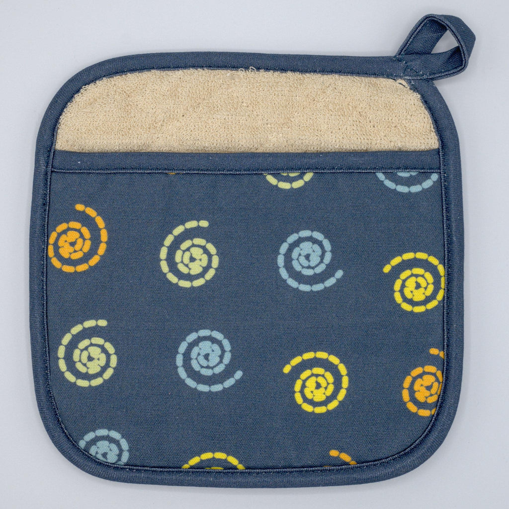 pocketed mushroom magic cotton pot holder from Hem And Tassel, on a wooden surface