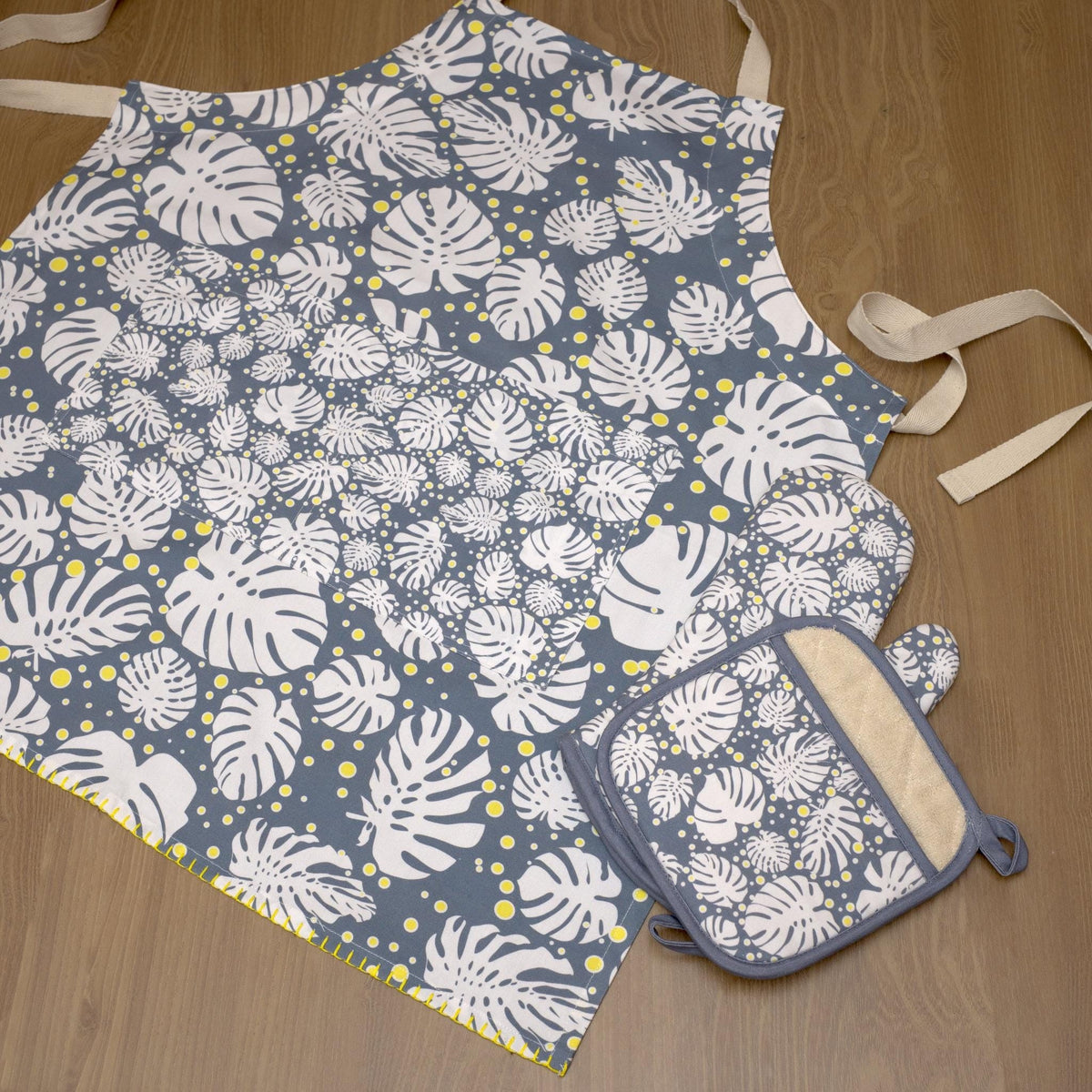 rich cotton oven mitt and pot holder in winter color, with matching apron in monster-ah design - from Hem And Tassel