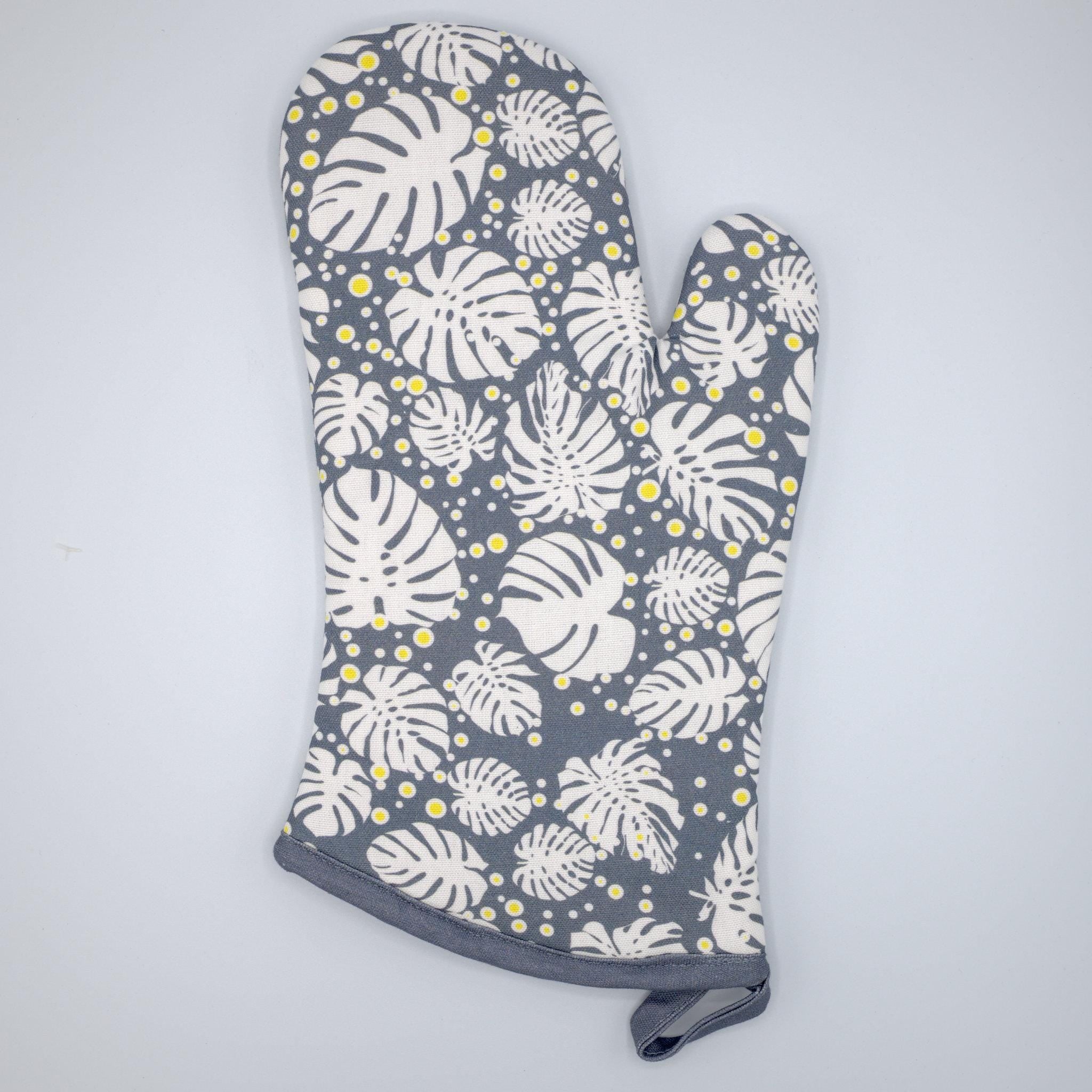 monster-ah oven mitt with leaf pattern on a gray background from Hem And Tassel 