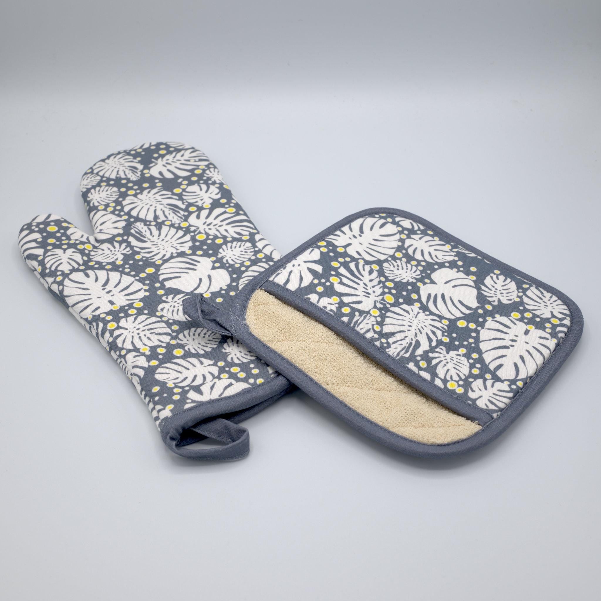 Set of monster-ah oven mitt and pot holder with leaf pattern on a gray background from Hem And Tassel 