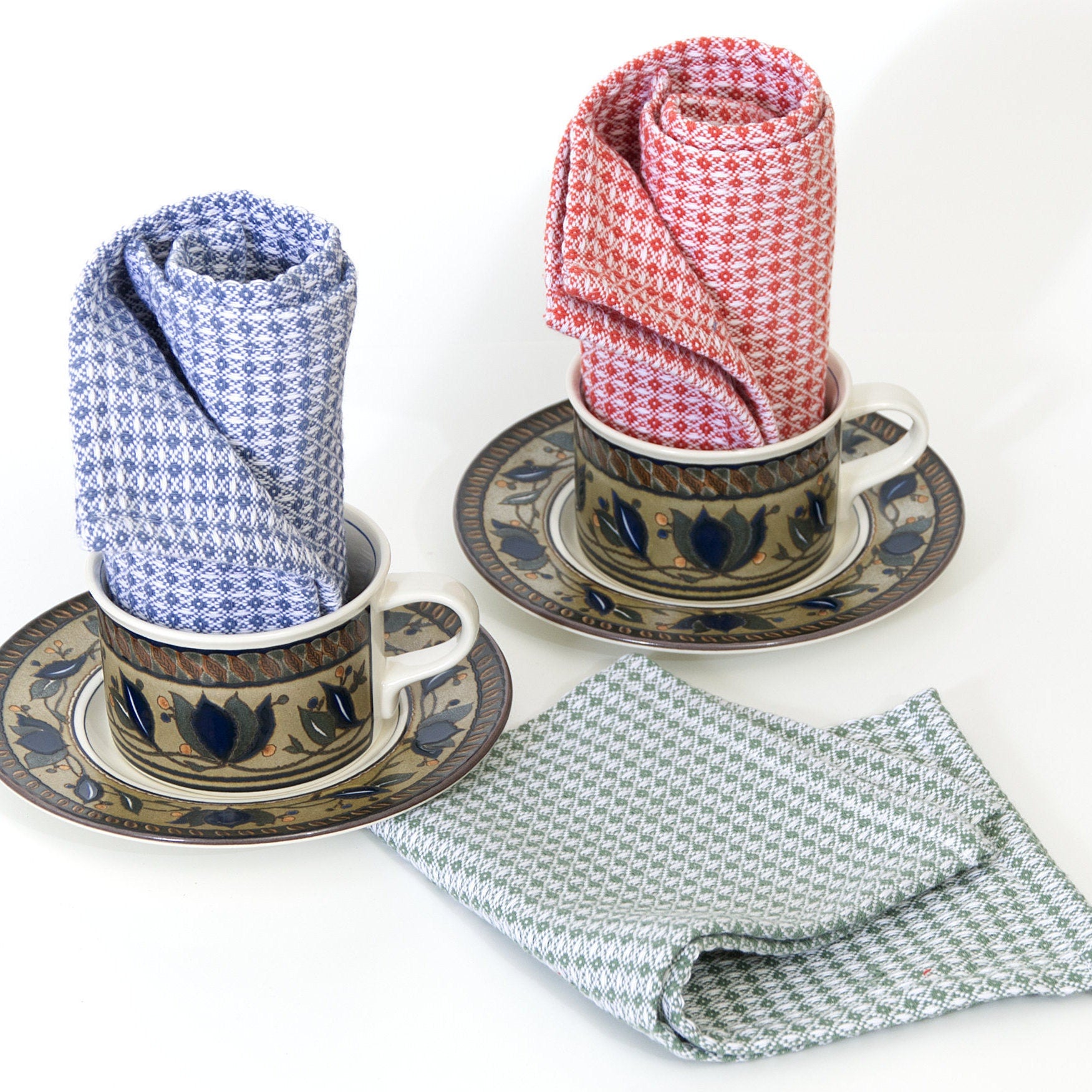 Three patterned diamond waffle wash cloths  in cups and saucers on a white background from Hem And Tassel 