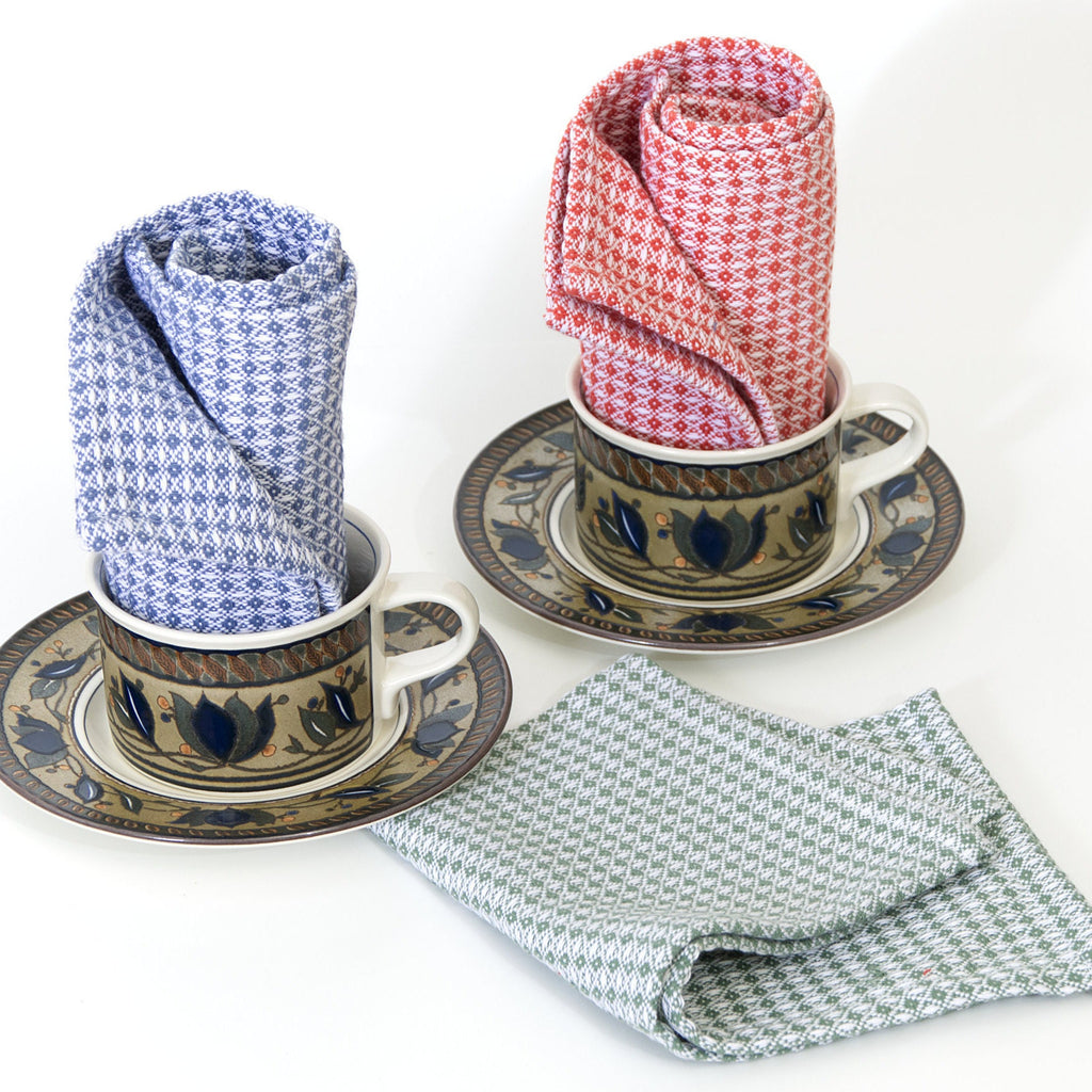 Three patterned diamond waffle wash cloths  in cups and saucers on a white background from Hem And Tassel 