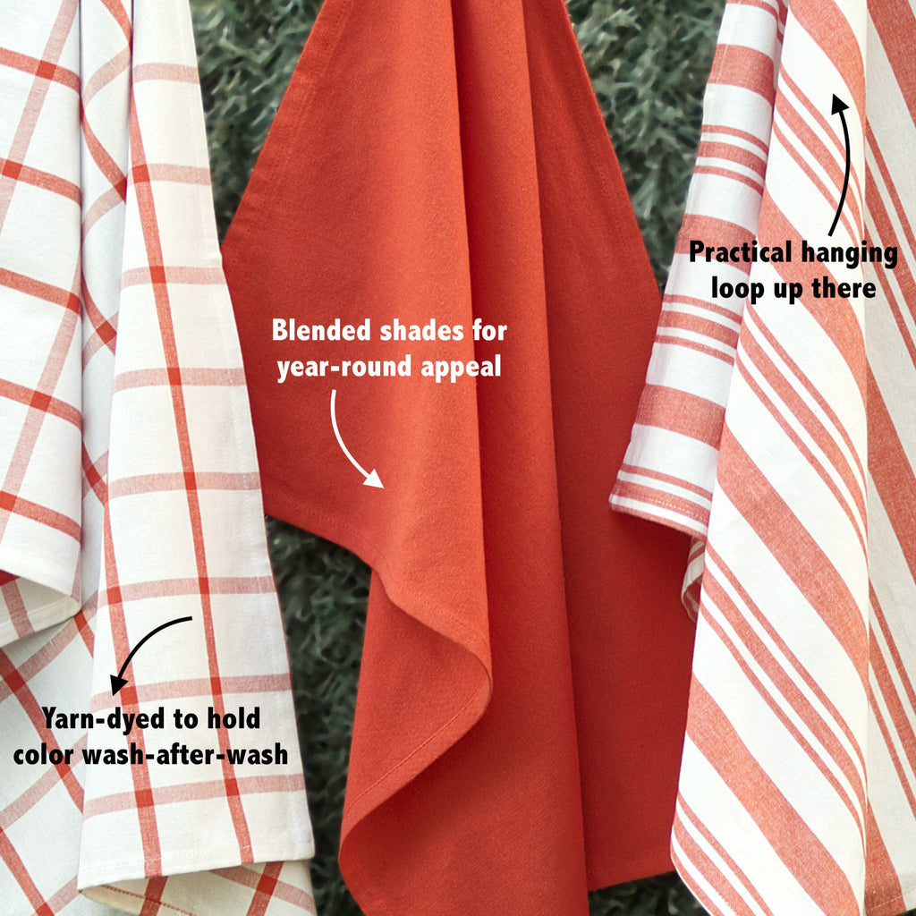 Red and white plaid towels with text highlighting features on a green background from hem and tassel