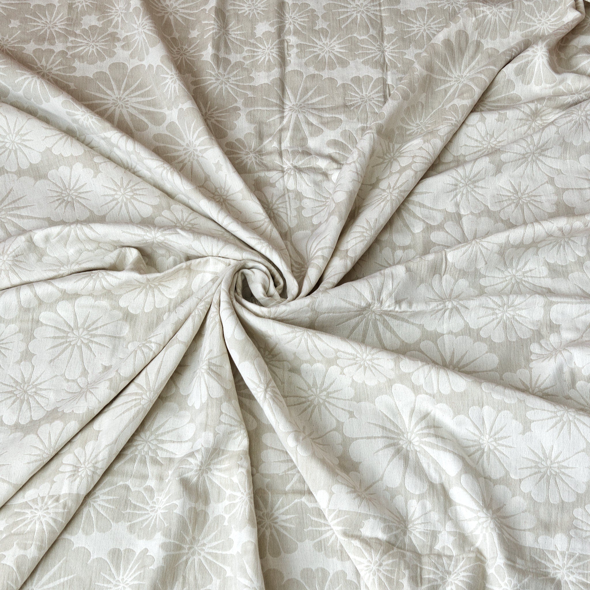 reversible wearable throw in pure cotton of bloom design in beige color, from Hem And Tassel, in a swirl