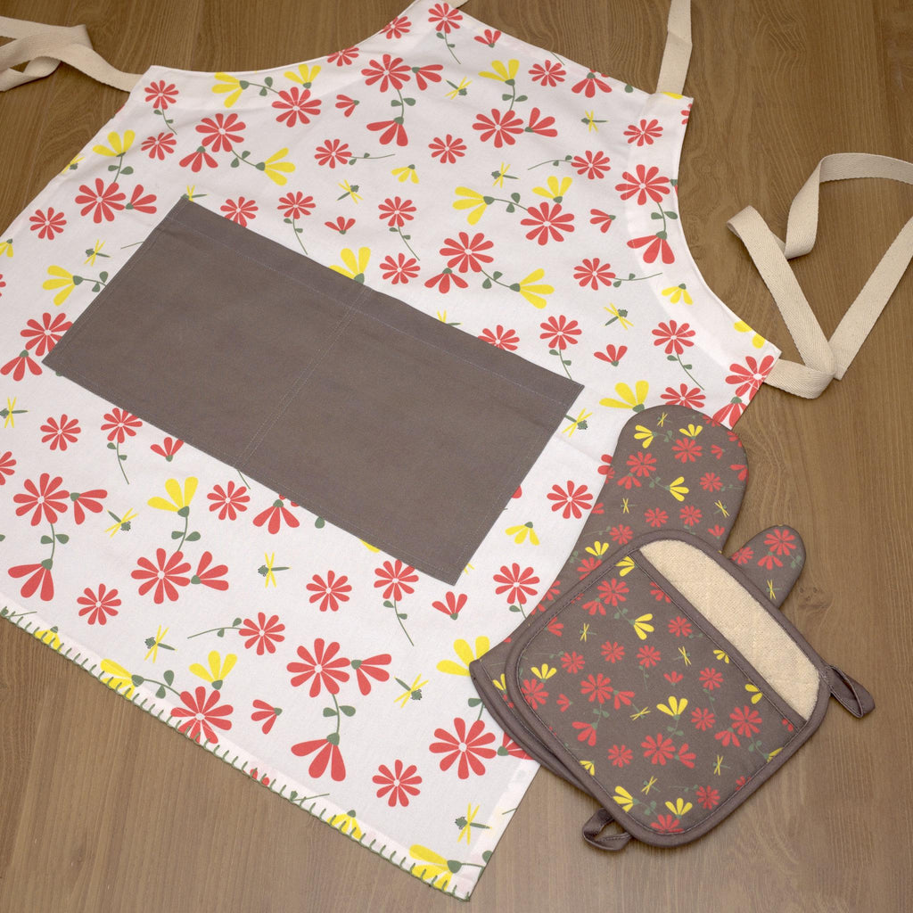 Floral shy dragonfly apron winter pockets and matching oven mitt on a wooden surface from Hem And Tassel 