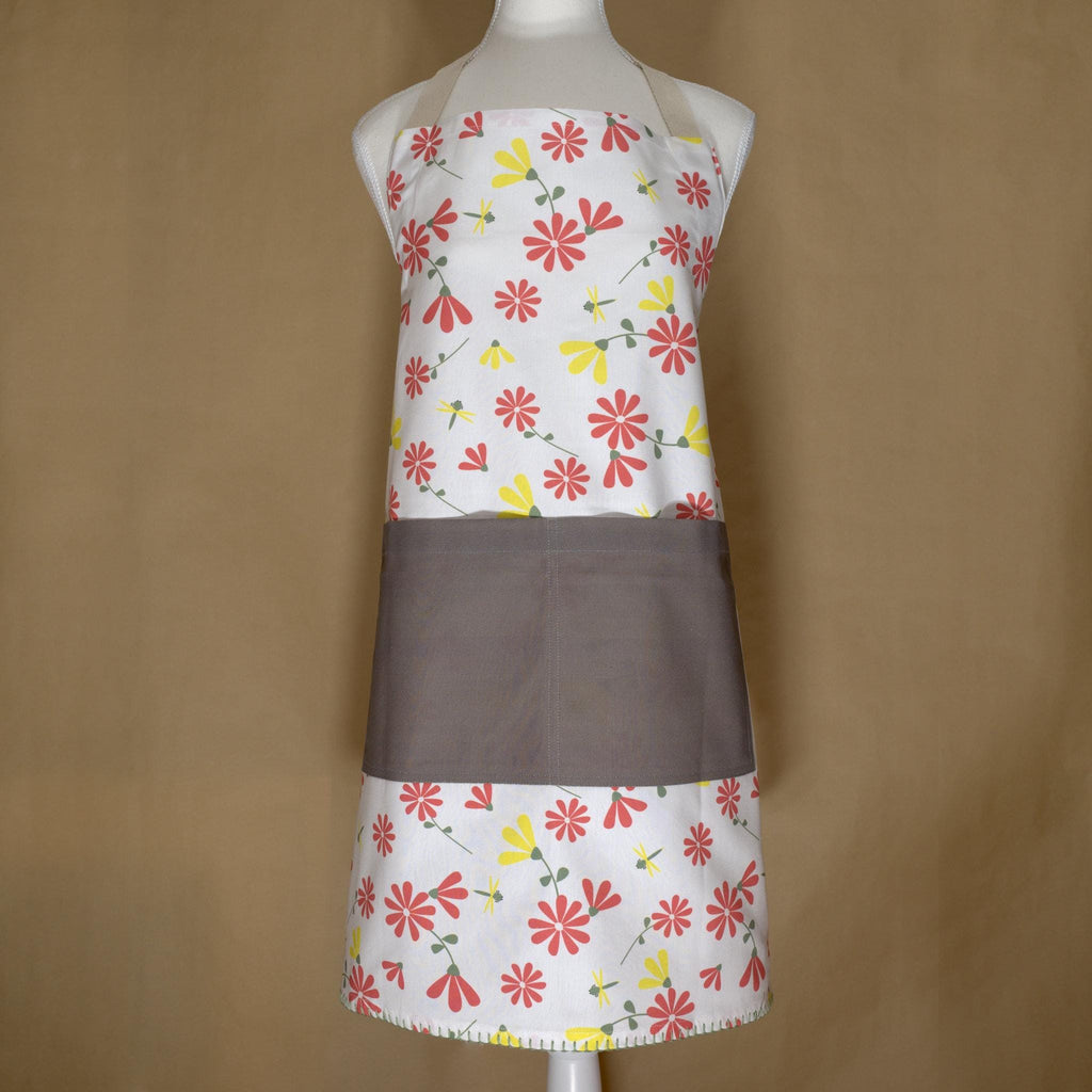 shy dragonfly apron in pink and yellow on a mannequin from Hem And Tassel 