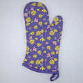 Purple shy dragonfly oven mitt with floral pattern on a white background from Hem And Tassel 