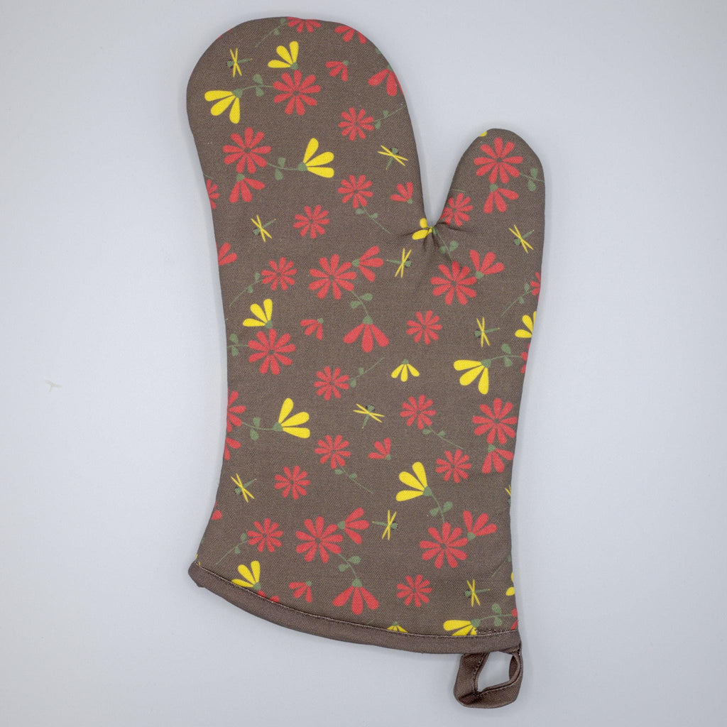 Floral-patterned shy dragonfly oven mitt on a white background from Hem And Tassel 