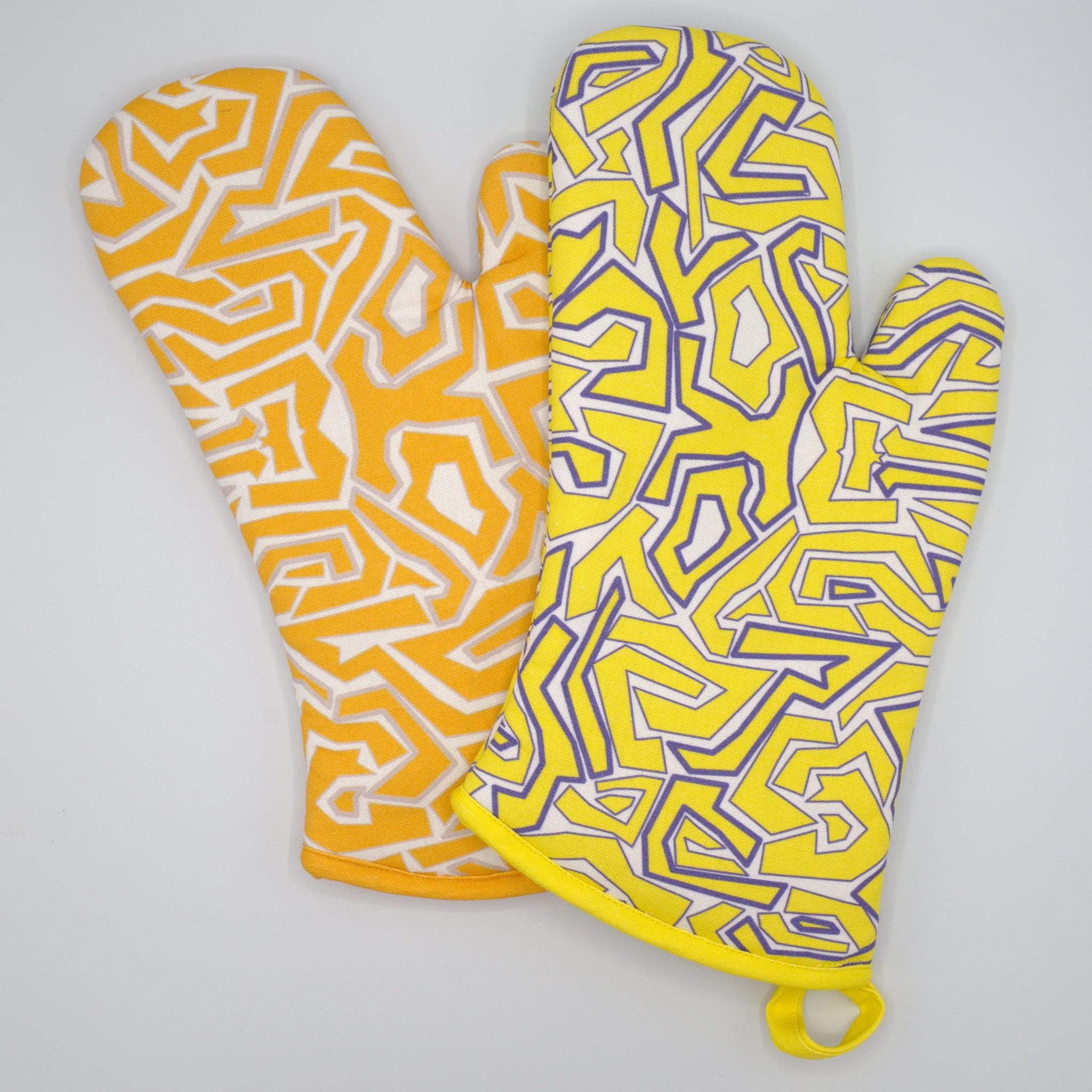 Two oven mitts with squggles geometric patterns on a white background from Hem And Tassel 