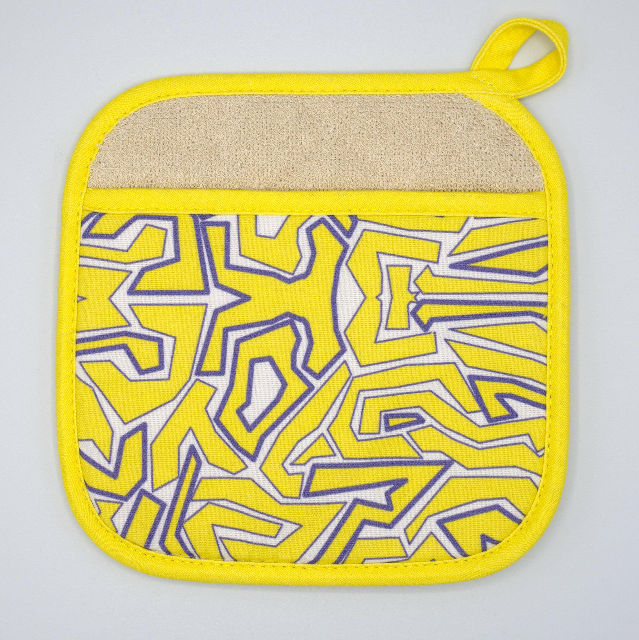Yellow squggles pot holder with geometric pattern on a light gray background from Hem And Tassel 