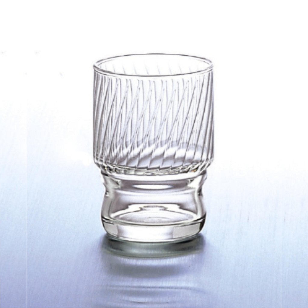 Clear stackable glass tumbler with textured design made in Japan, from Hem And Tassel on a light gray background