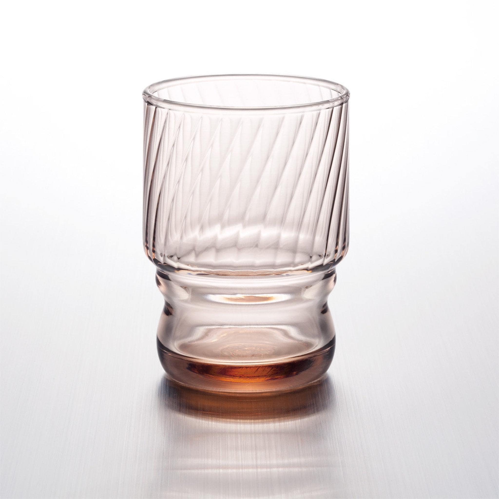 coffee colored stackable glass tumbler with textured design made in Japan, from Hem And Tassel on a light gray background