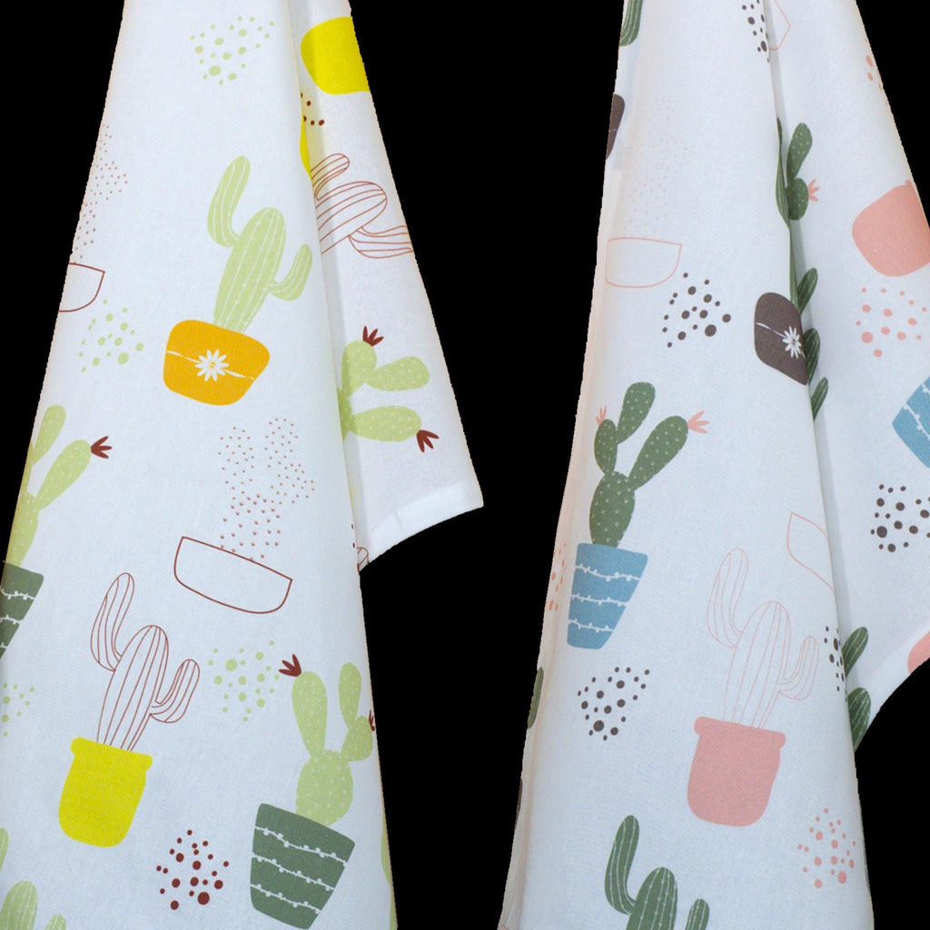 close up of two thorny issue kitchen towels with cactus pattern on a white background from Hem And Tassel 