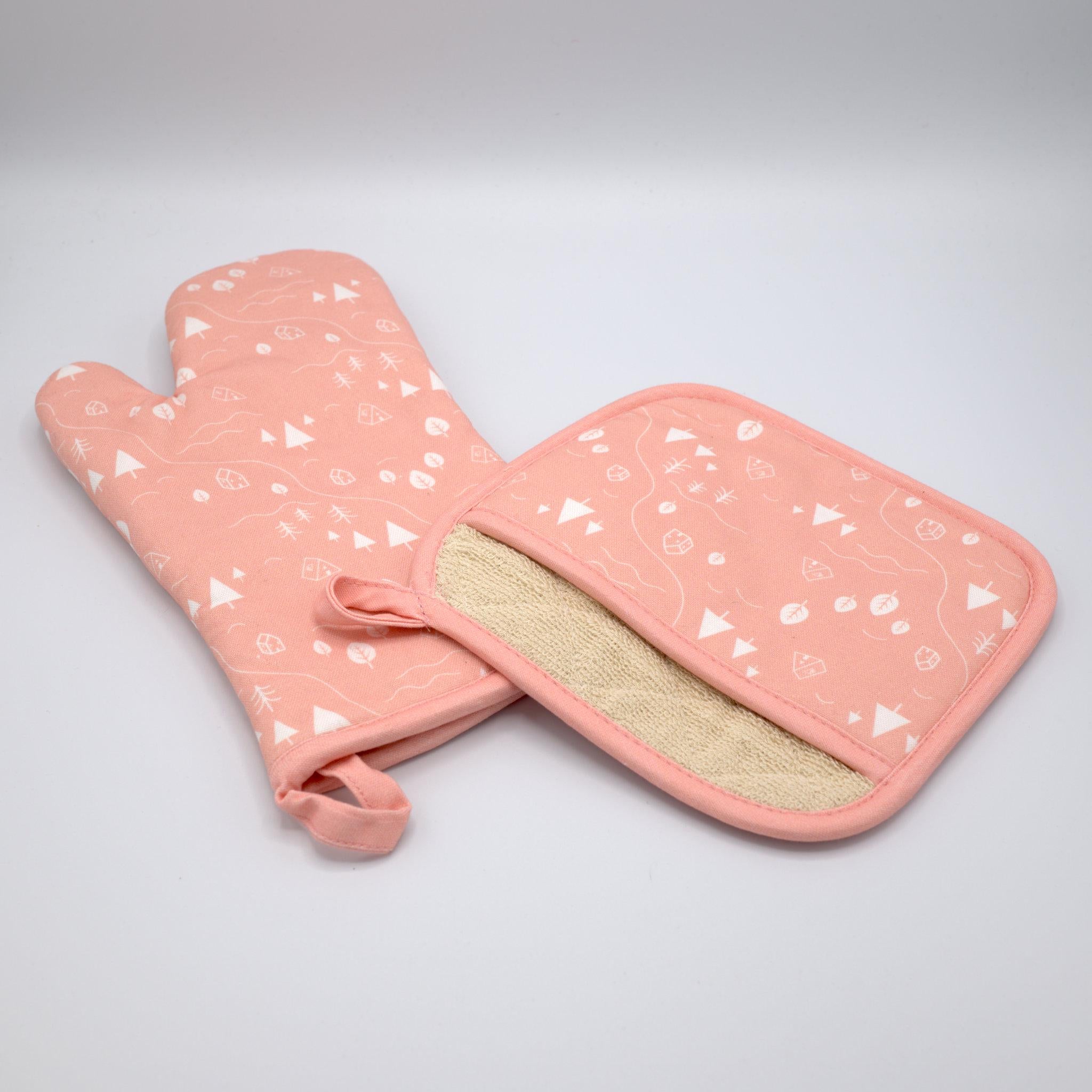 cotton oven mitt and pocketed pot holder, of tiny countryside design in blush, on a light grey background, from Hem And Tassel 