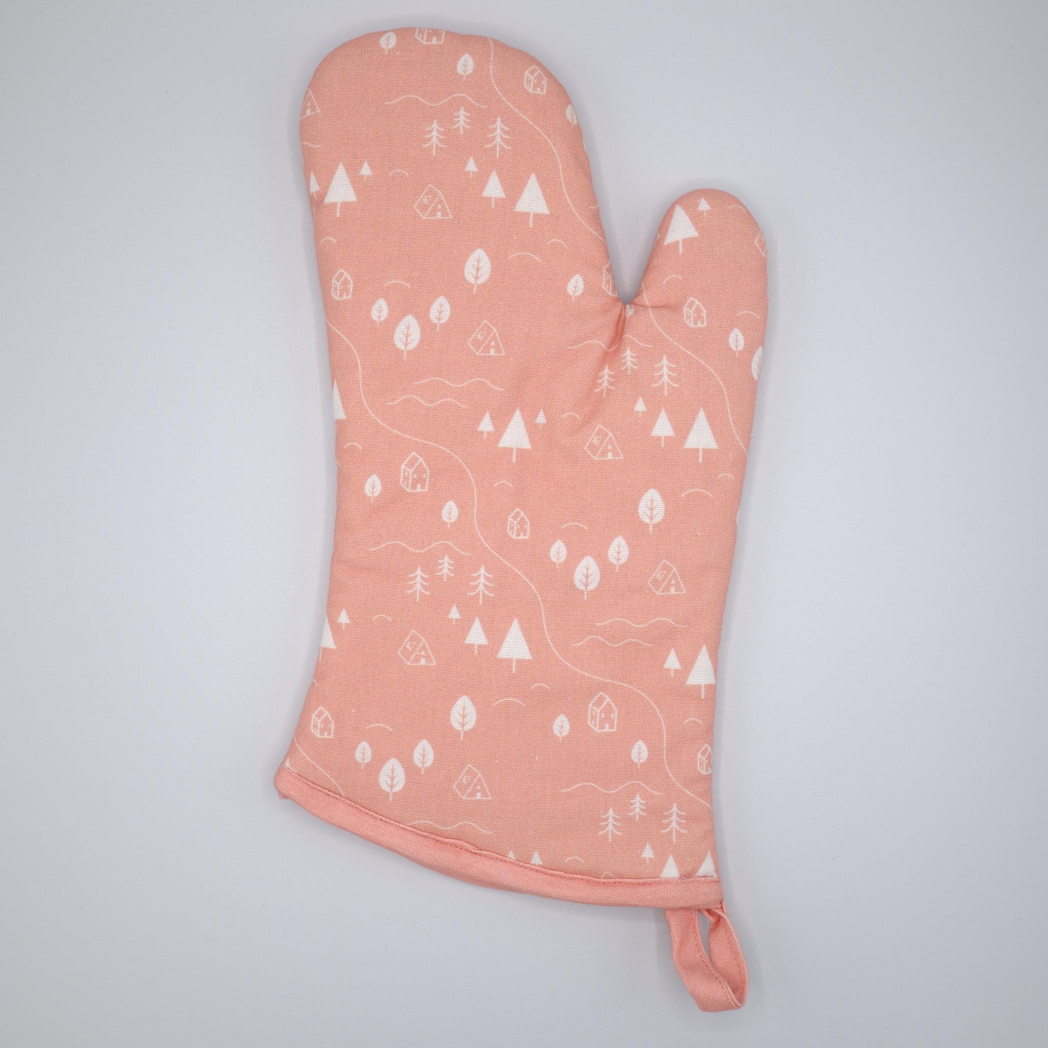 cotton oven mitt of tiny countryside design in blush, on a light grey background, from Hem And Tassel 