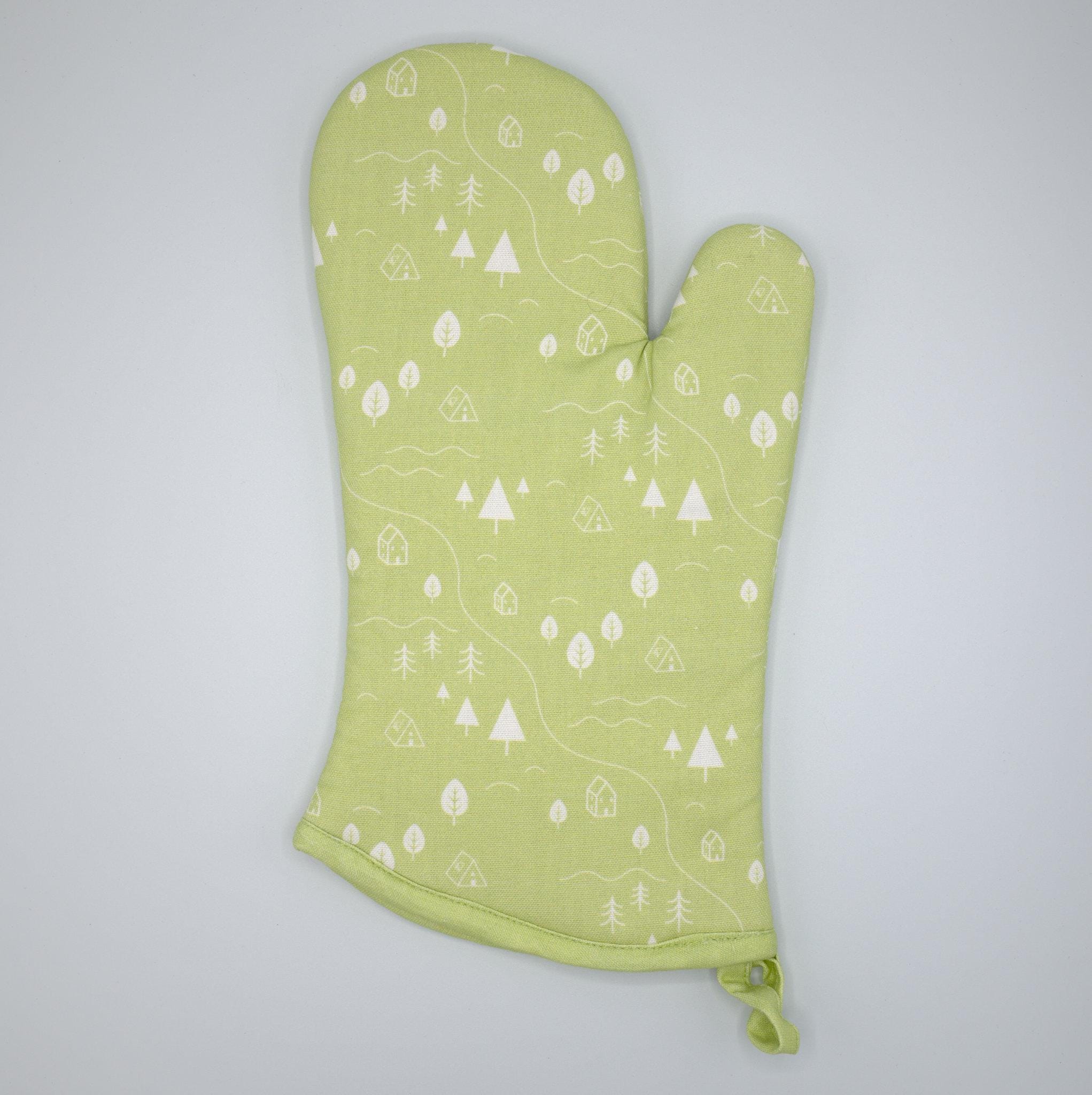 cotton oven mitt of tiny countryside design in mint, on a light grey background, from Hem And Tassel 