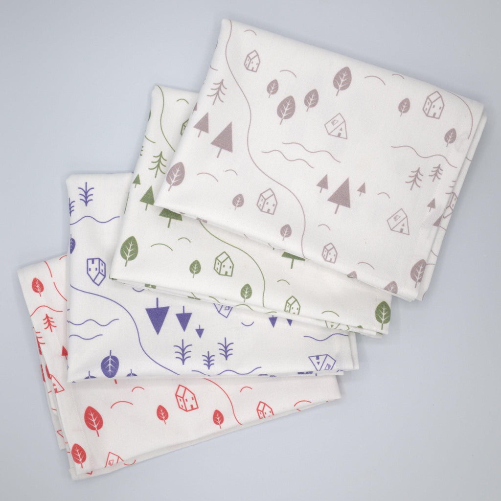 Set of four ftiny countryside kitchen towels with nature-themed patterns on a gray background from Hem And Tassel 