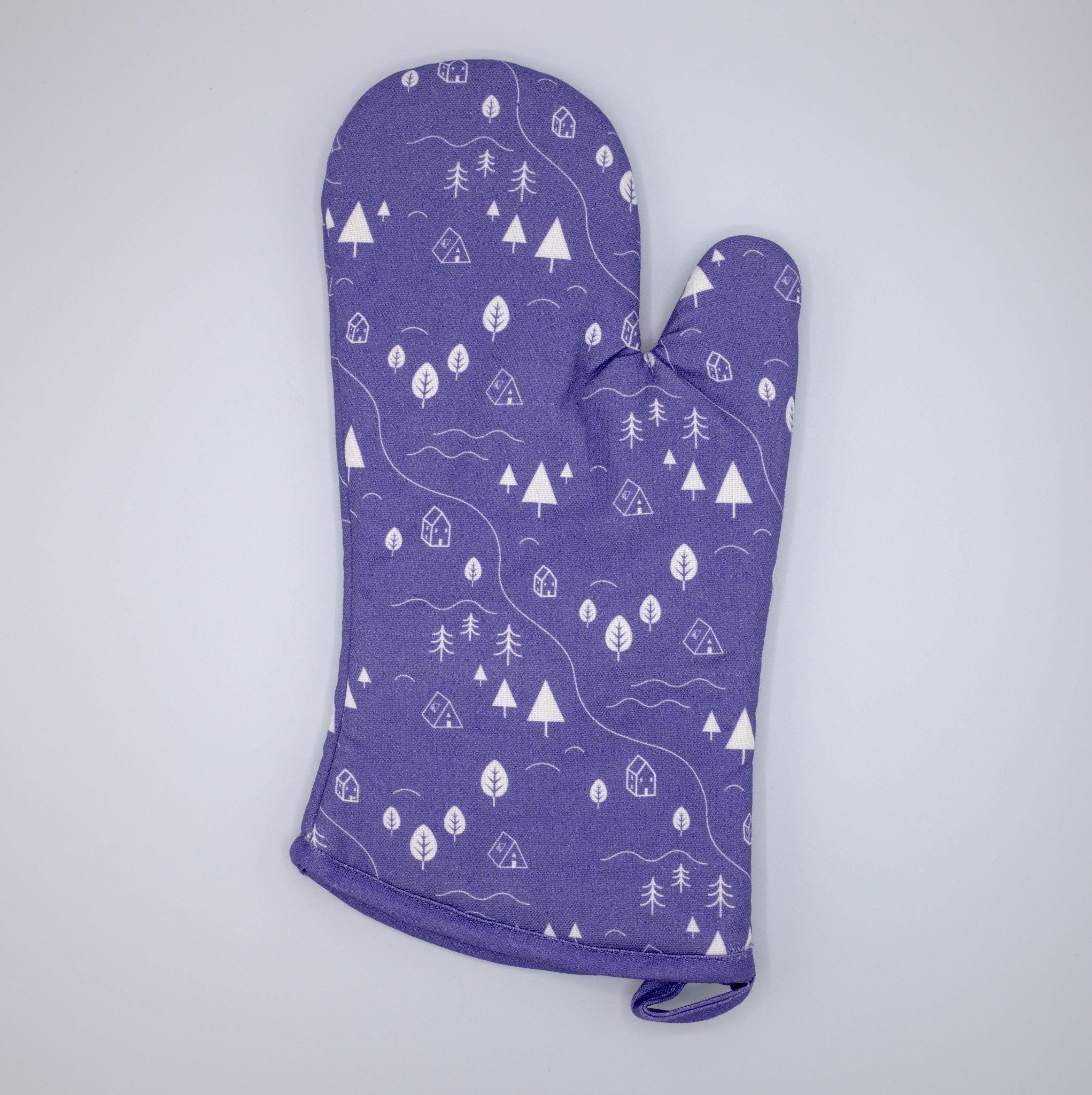 cotton oven mitt of tiny countryside design in purple, on a light grey background, from Hem And Tassel 