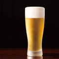 twinkle frost bling beer glass with beer inside made in Japan, from Hem And Tassel on a dark background 
