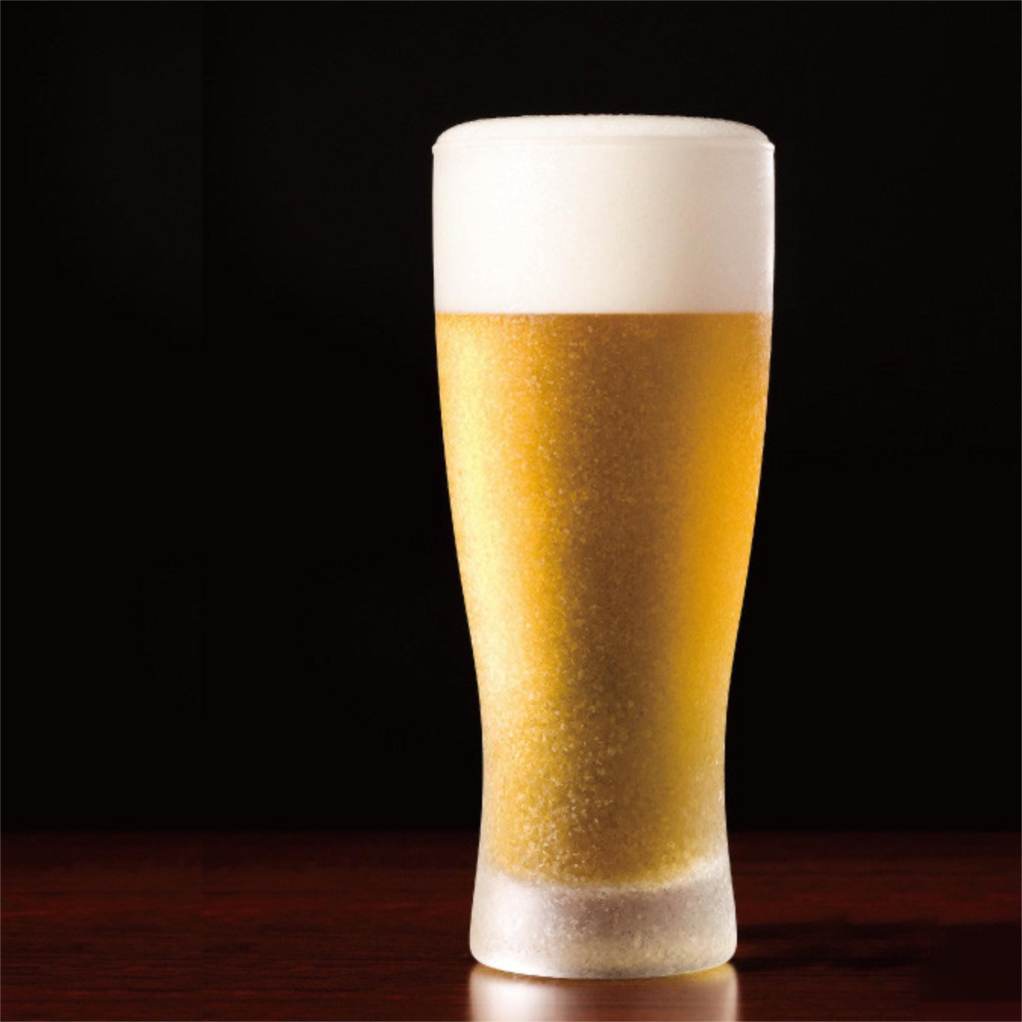twinkle frost bling beer glass with beer inside made in Japan, from Hem And Tassel on a dark background 