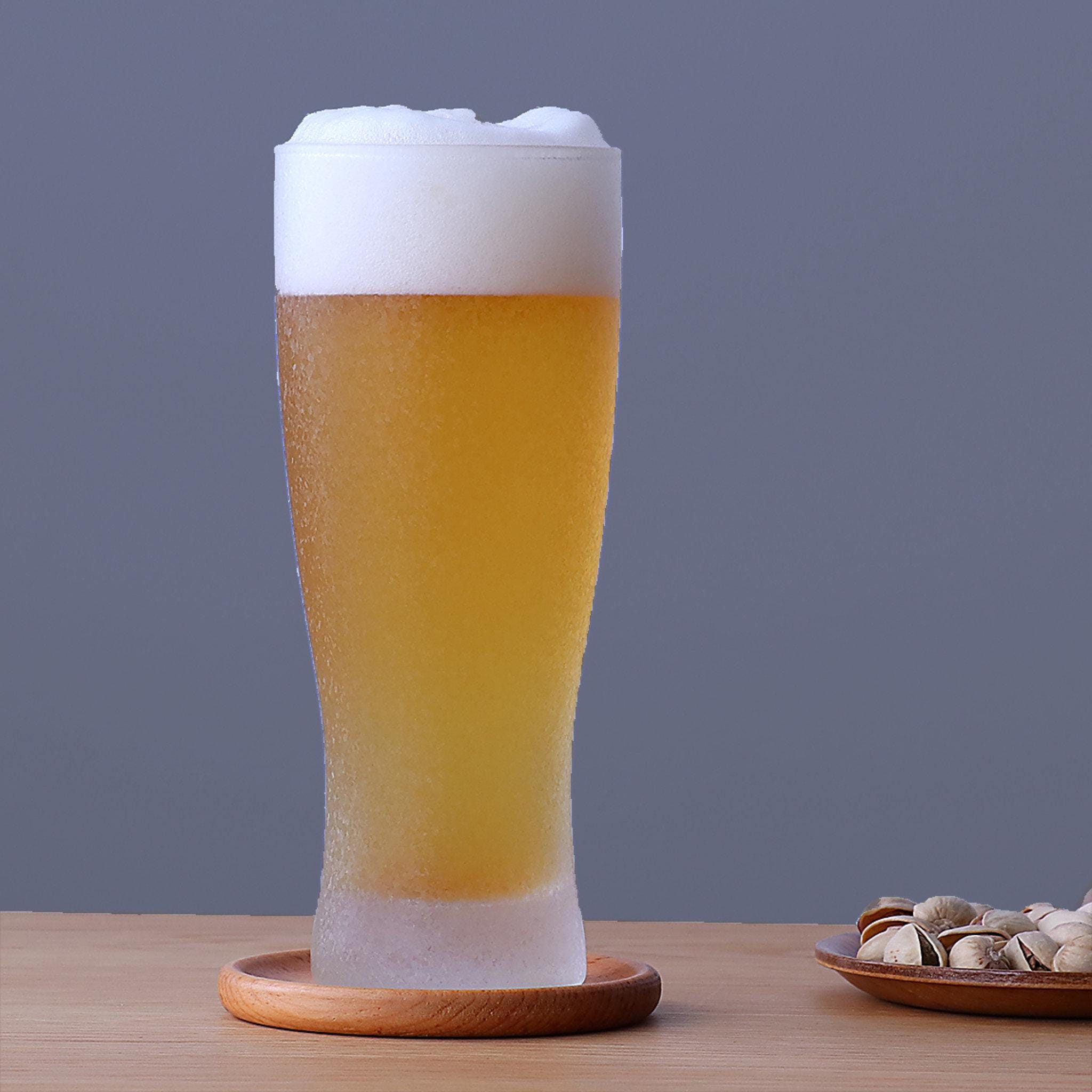 twinkle frost bling beer glass with textured frosted coating made in Japan, from Hem And Tassel on a gray background with pistachios
