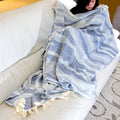 waves design wearable cotton throw in blue color draped on a woman lying on a sofa - from Hem And Tassel