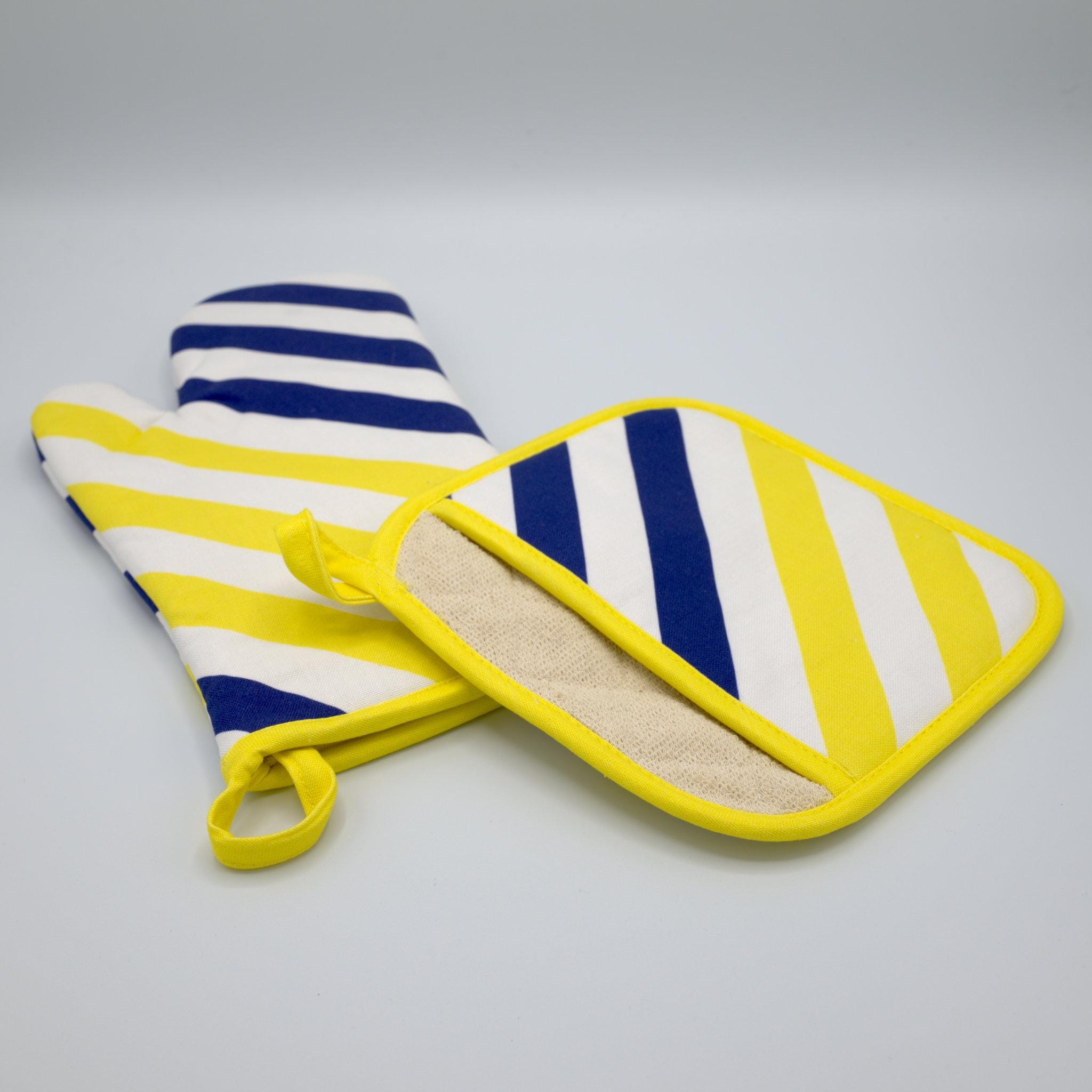yellow piano design cotton oven mitt and pocketed pot holder with hanging loops on grey background from Hem And Tassel