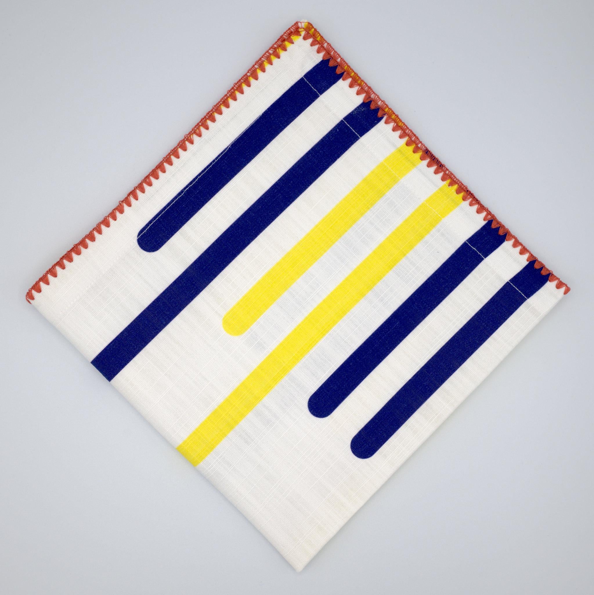 yellow piano cotton slub dinner napkin with red stitching from Hem And Tassel, on a light gray background