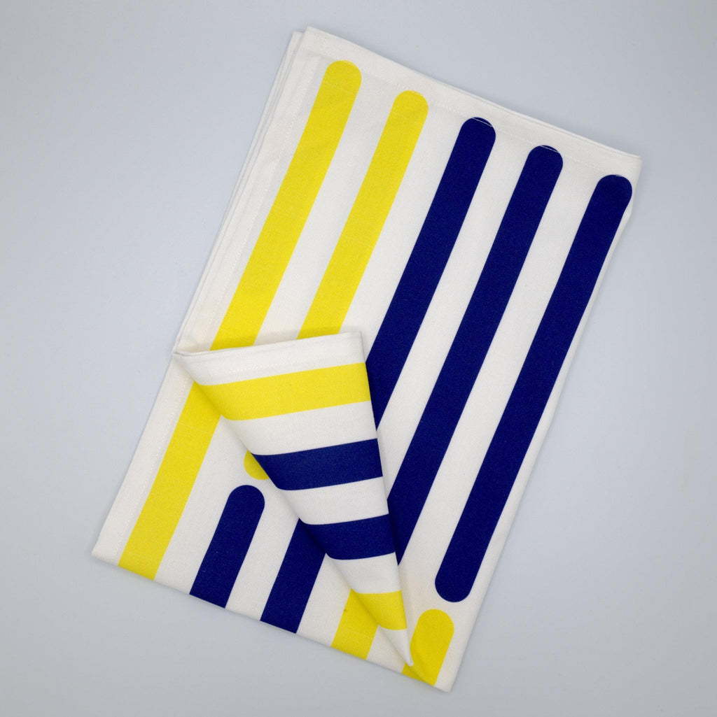 yellow piano tea towel with vertical yellow and blue stripes on a gray background from Hem And Tassel 