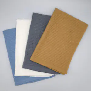Jekyll and Hyde reversible design four tea towels fanned and stacked from hem and tassel