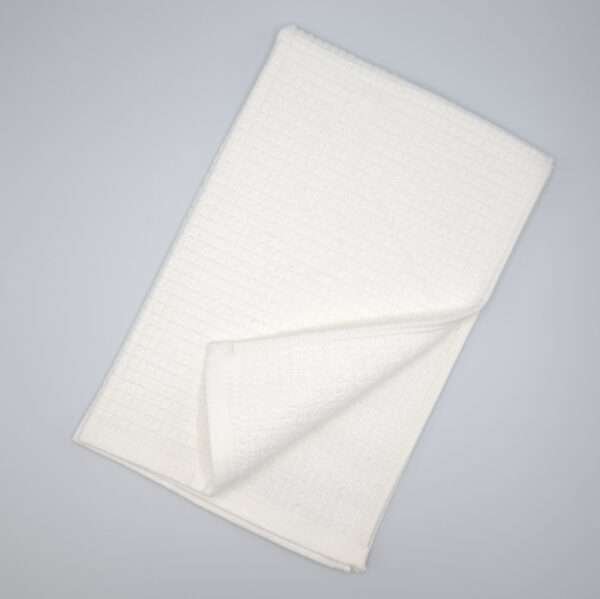 Jekyll and Hyde design tea towel in white flat folded from hem and tassel