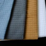 set of 4 towels in 4 colors with 3-D weave on one side and terry on the other