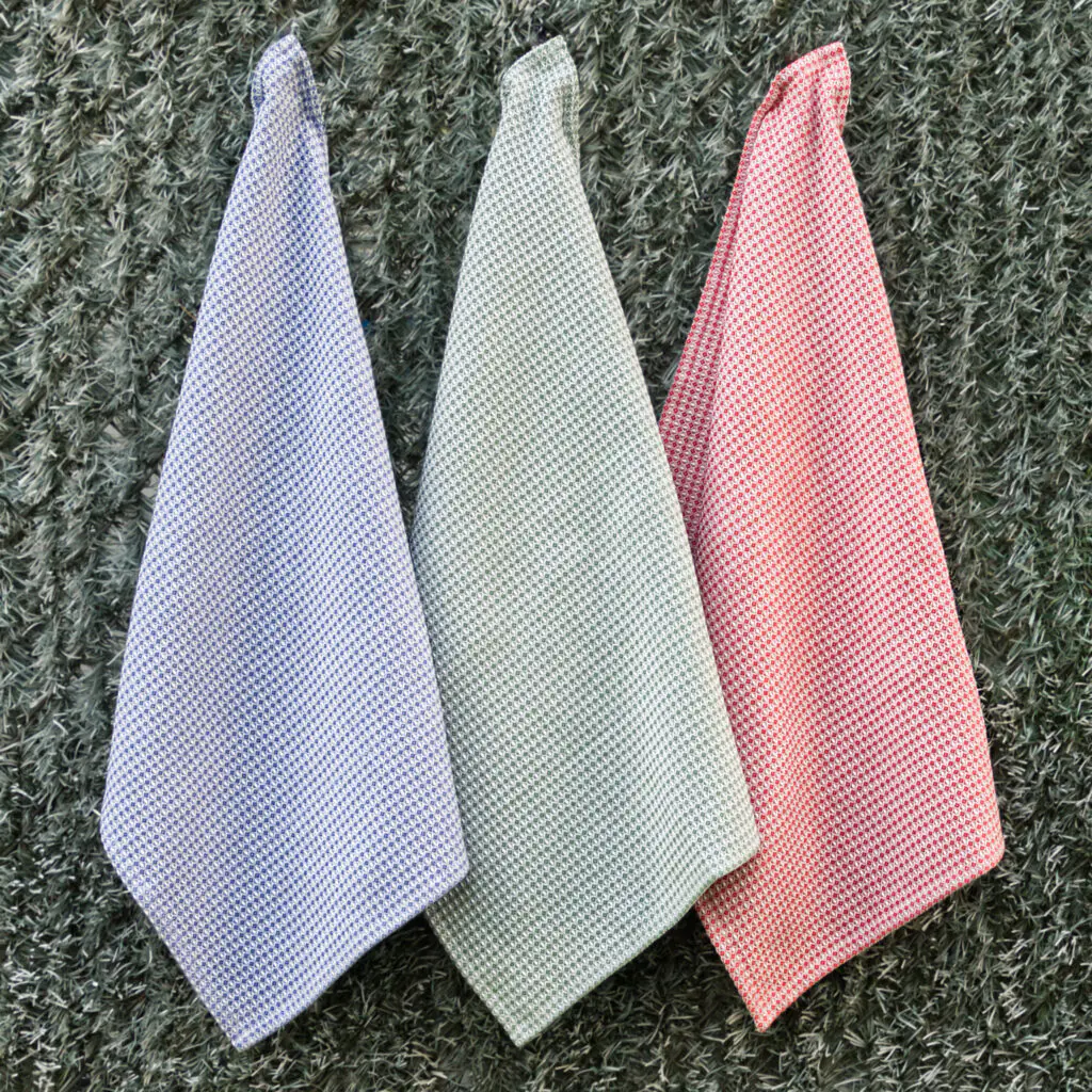 diamond waffle set of 3 cotton towels shown hanging in red