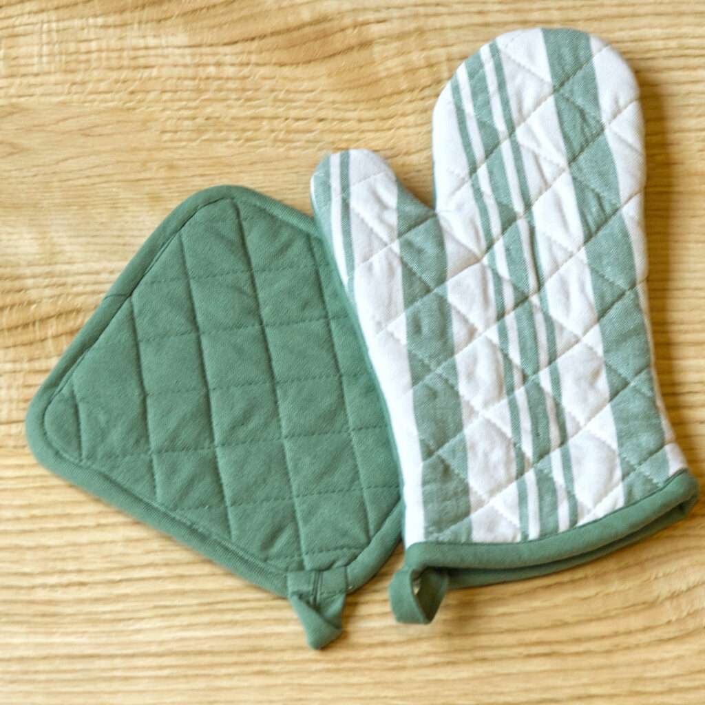 Quilted Decade classic oven mitt and pot holder shown in blue color