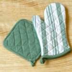 Quilted Decade classic oven mitt and pot holder shown in blue color