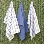 Three large 100% cotton kitchen towels in classic flat weave shown hanging