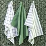 Three large 100% cotton decade classic kitchen towels in flat weave shown hanging