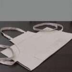 grill and drill Pro-grade, heavy duty, drill cotton cooking and baking Apron, in in grey with divided pocket and with adjustable neck straps