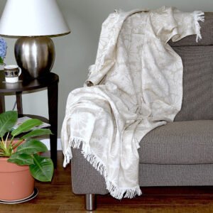 Throw From Europe 100% Cotton Reversible Jacquard Bloom pattern in beige option on sofa