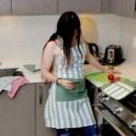 Girl wearing dual adjustable everyday classic apron in cotton