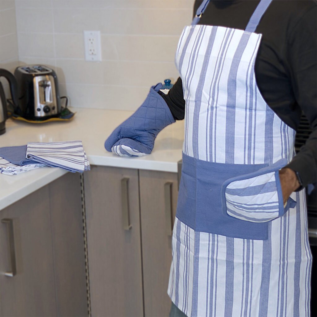 Baking Set, Yarn Dyed Cotton Percale, Blue, man wearing apron, oven mitt and pot holder.jpg