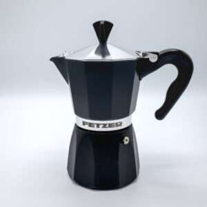 Bottom of 6-cup Dolce Vita classic black Moka Pot lying on table runner
