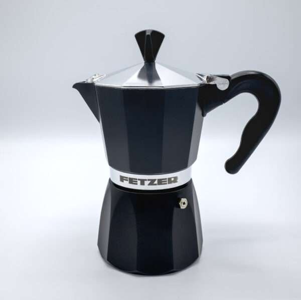 Bottom of 6-cup Dolce Vita classic black Moka Pot lying on table runner
