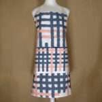 Jute impossible design apron on mannequin from hem and tassel